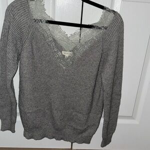 Light gray sweater with light lace along the lining